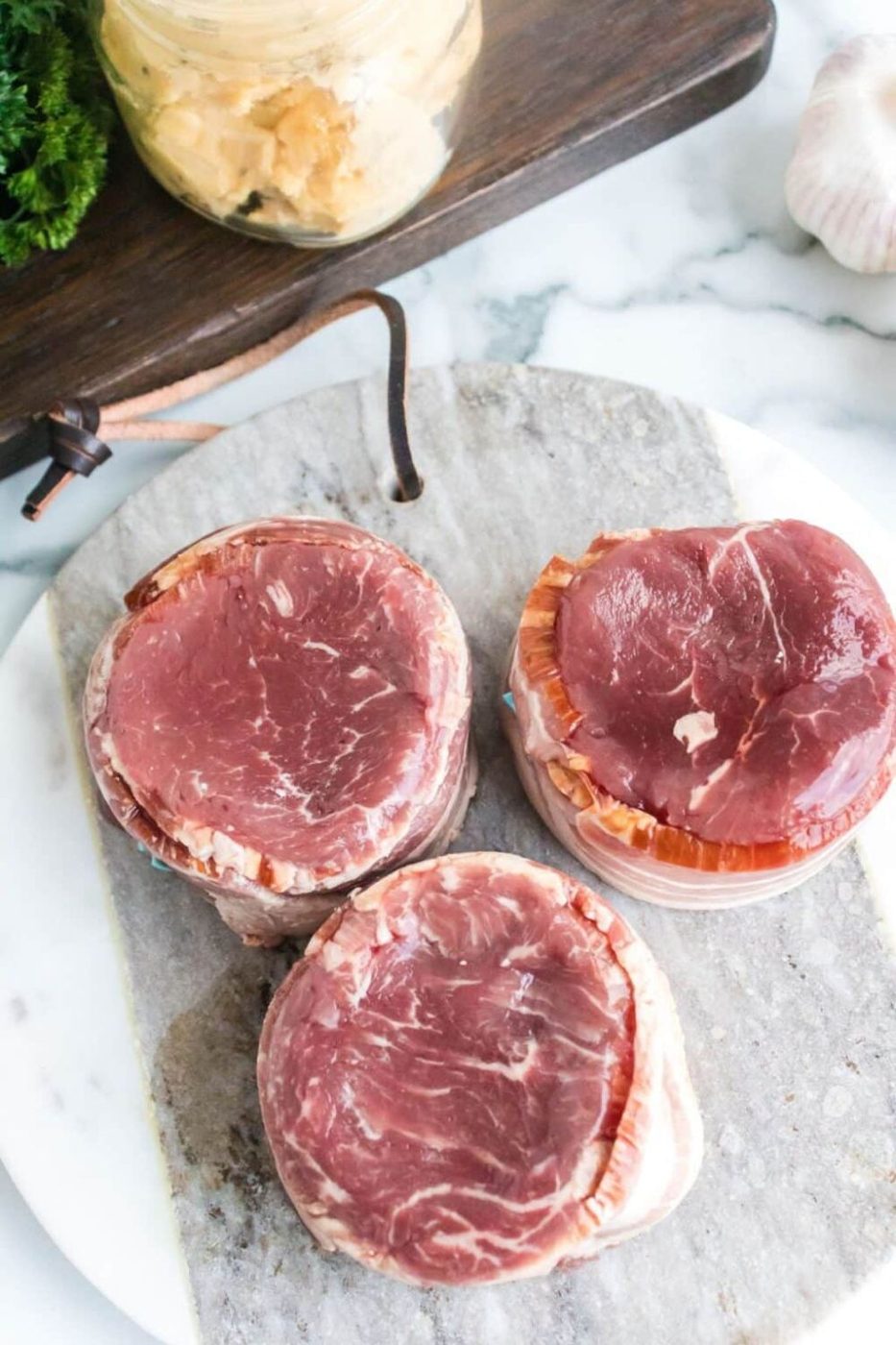 raw filet mignons on table 
