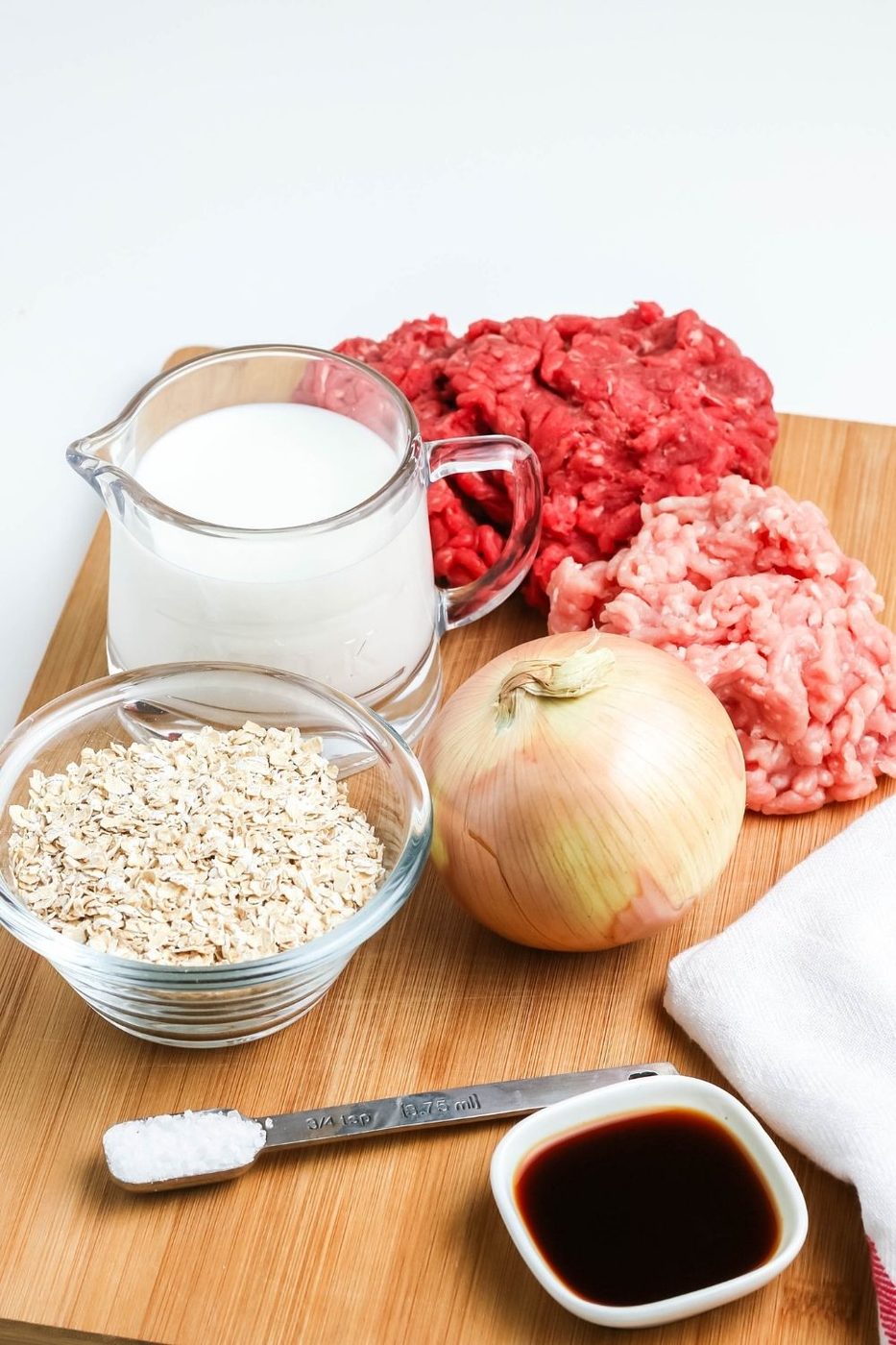 meatball ingredients on a cutting board