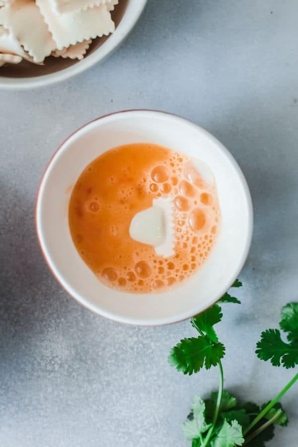 ravioli dipped in egg wash