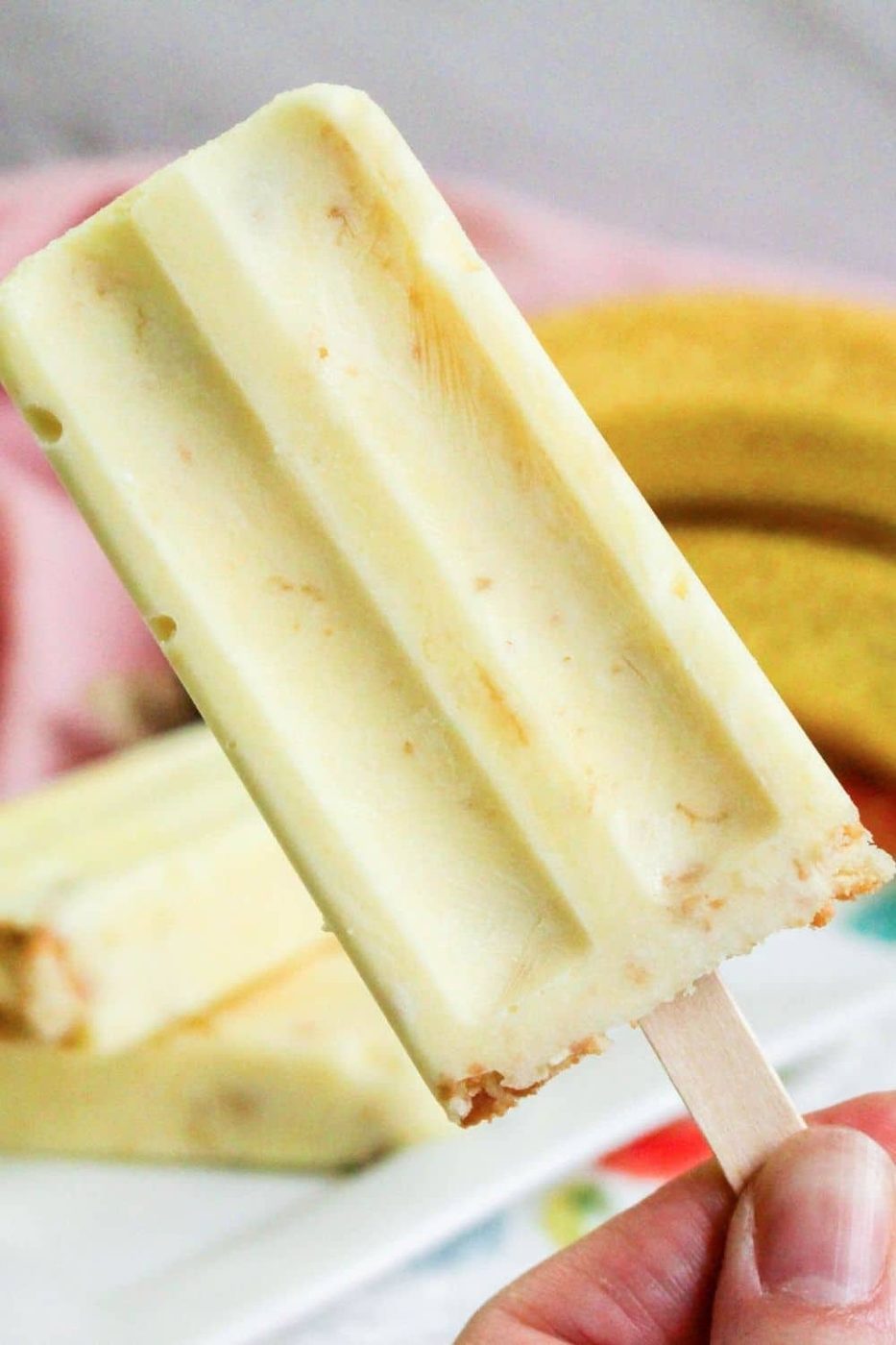 banana frozen dessert being held in hand 