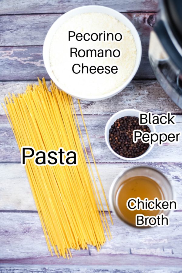 cacio de pepe ingredients on wood counter 
