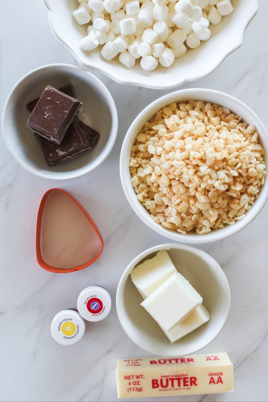 ingredients for rice krispie treats on a marble table 