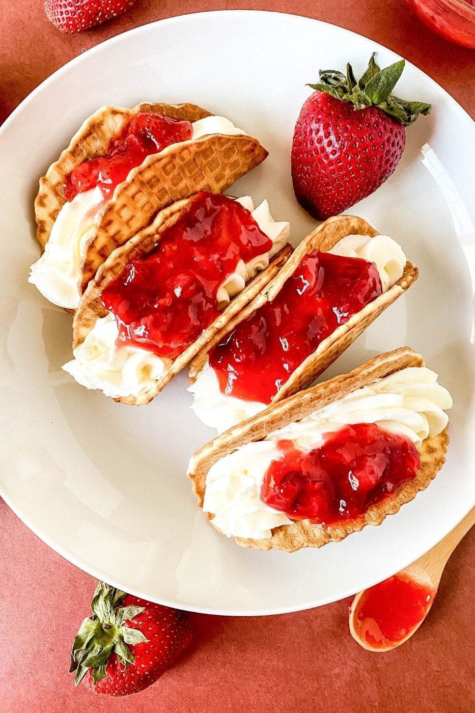 dessert taco on a plate with berries 