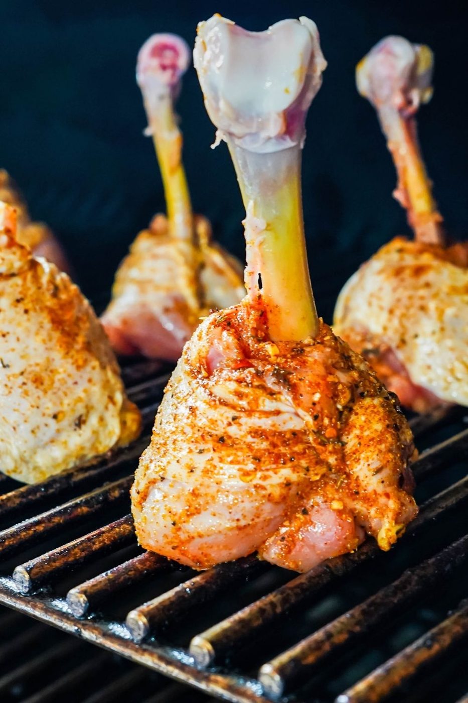 chicken lollipops on the grill grate 