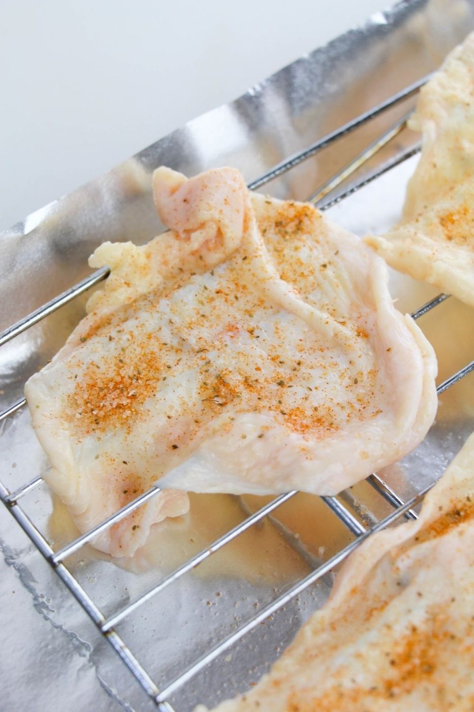chicken skins on a cooling rack seasoned 
