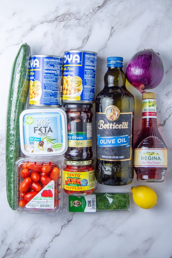 garbanzo bean salad ingredients on marble countertop 