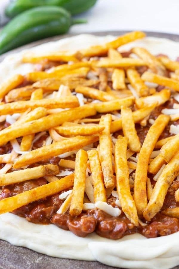 fry pizza on chili cheese pizza
