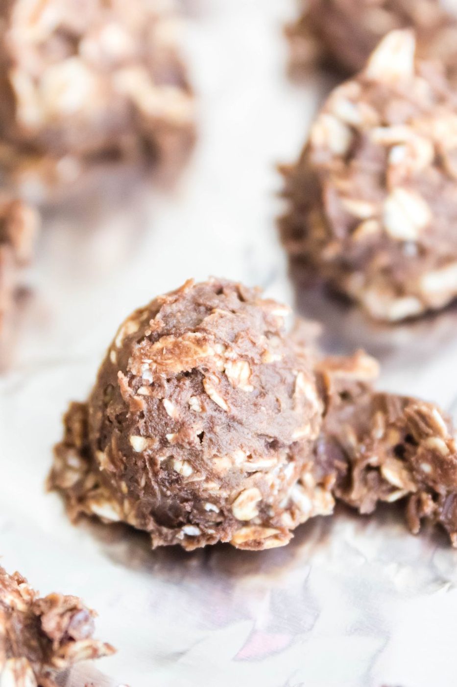 close up of protein ball on aluminum foil lined pan