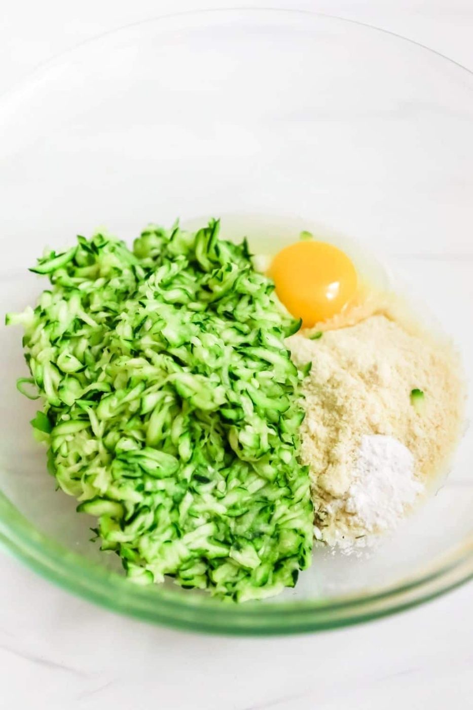 zucchini, flour, egg in bowl