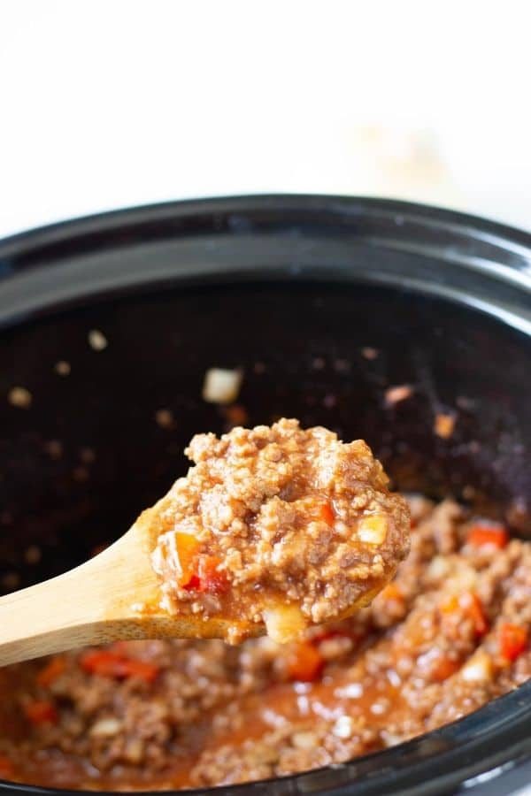 spoon full of homemade sloppy joe with wooden spoon