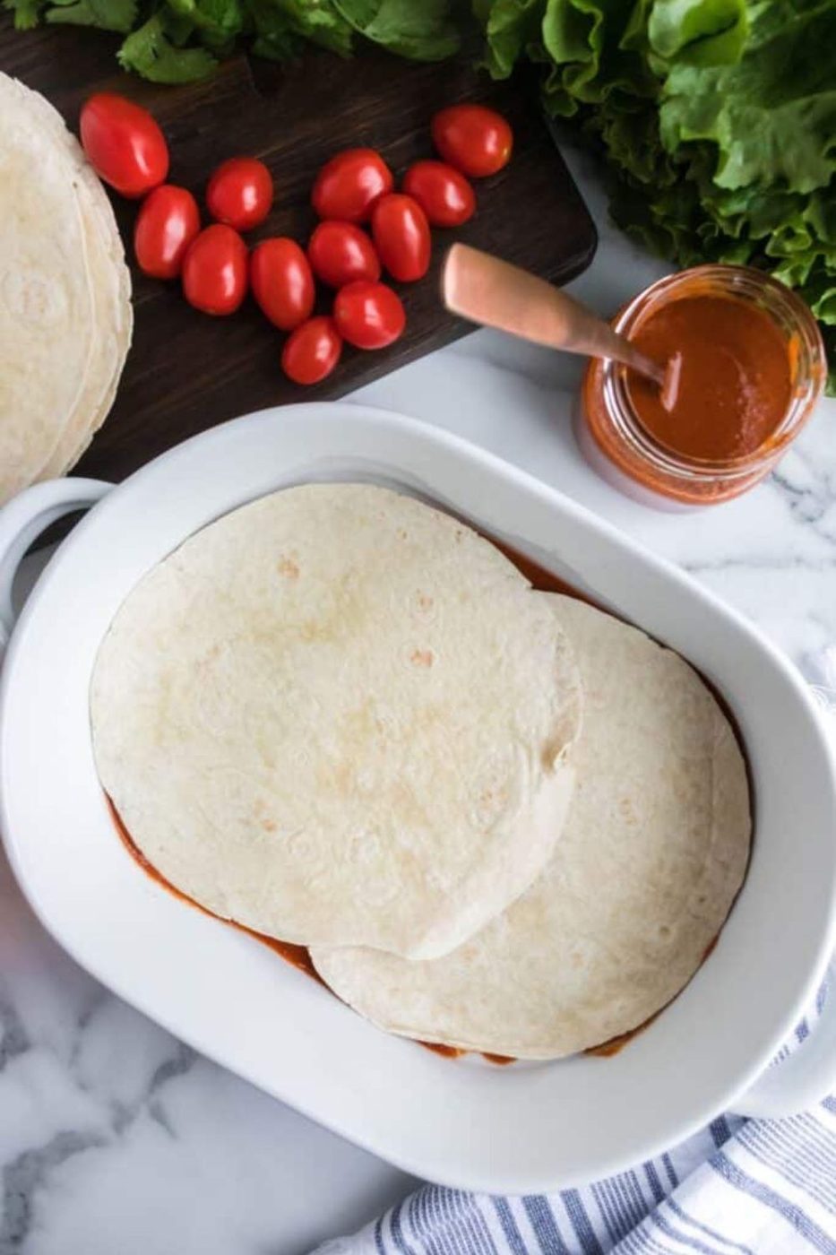 flour tortillas in the bottom of pan 