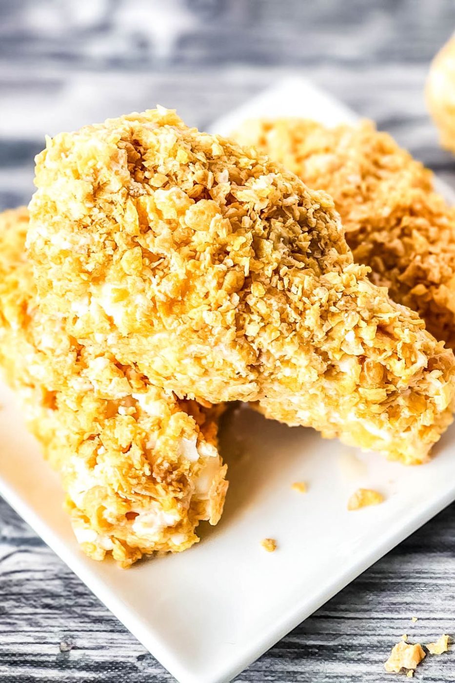 not fried chicken ice cream bars sitting on a white table with a wooden background 