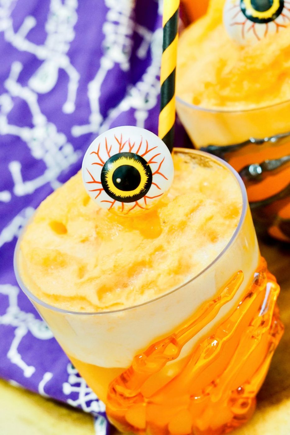 side view of a fanta float on a wooden table 