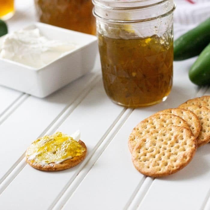 instant pot jelly with crackers and cream cheese smothered crackers on side
