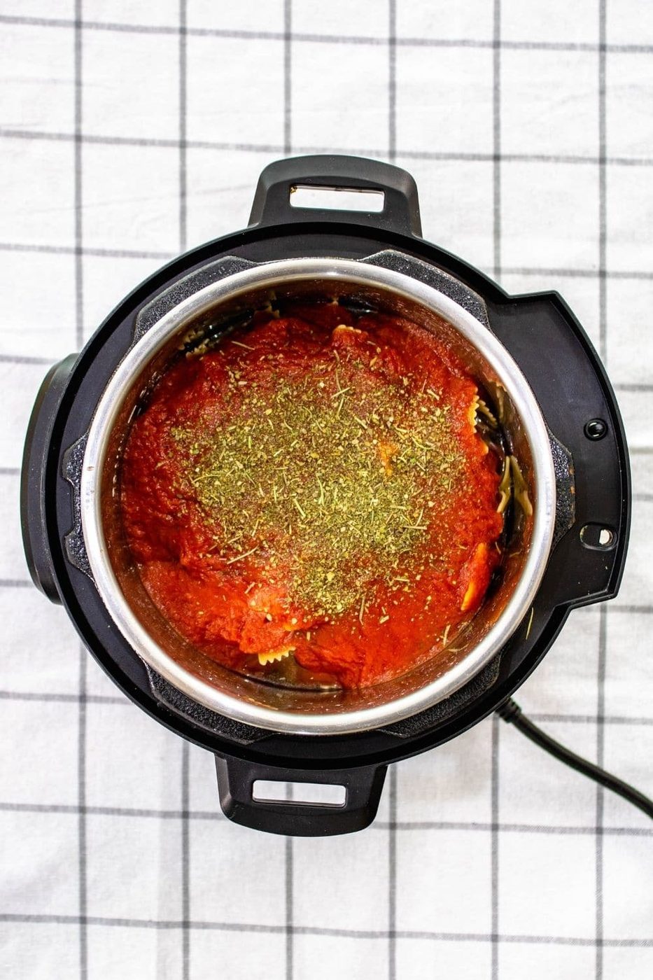 instant pot on table with towel under it 