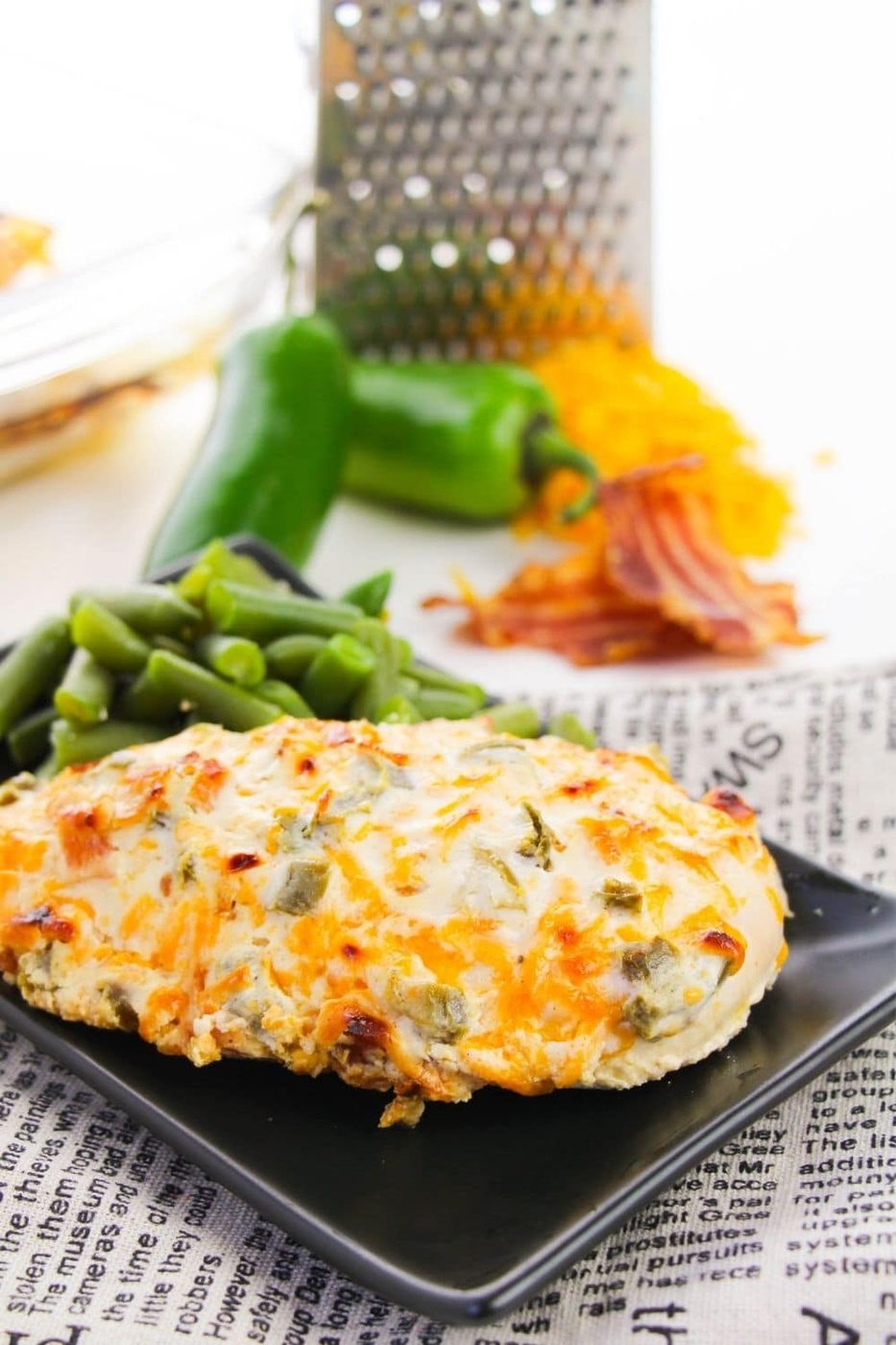chicken on plate with beans, and ingredients to make behind it