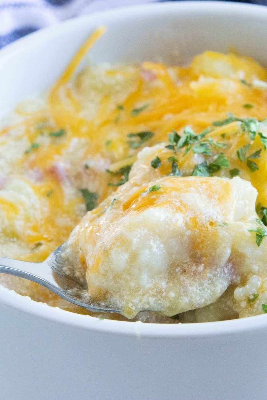 spoon with cheese and dumpling