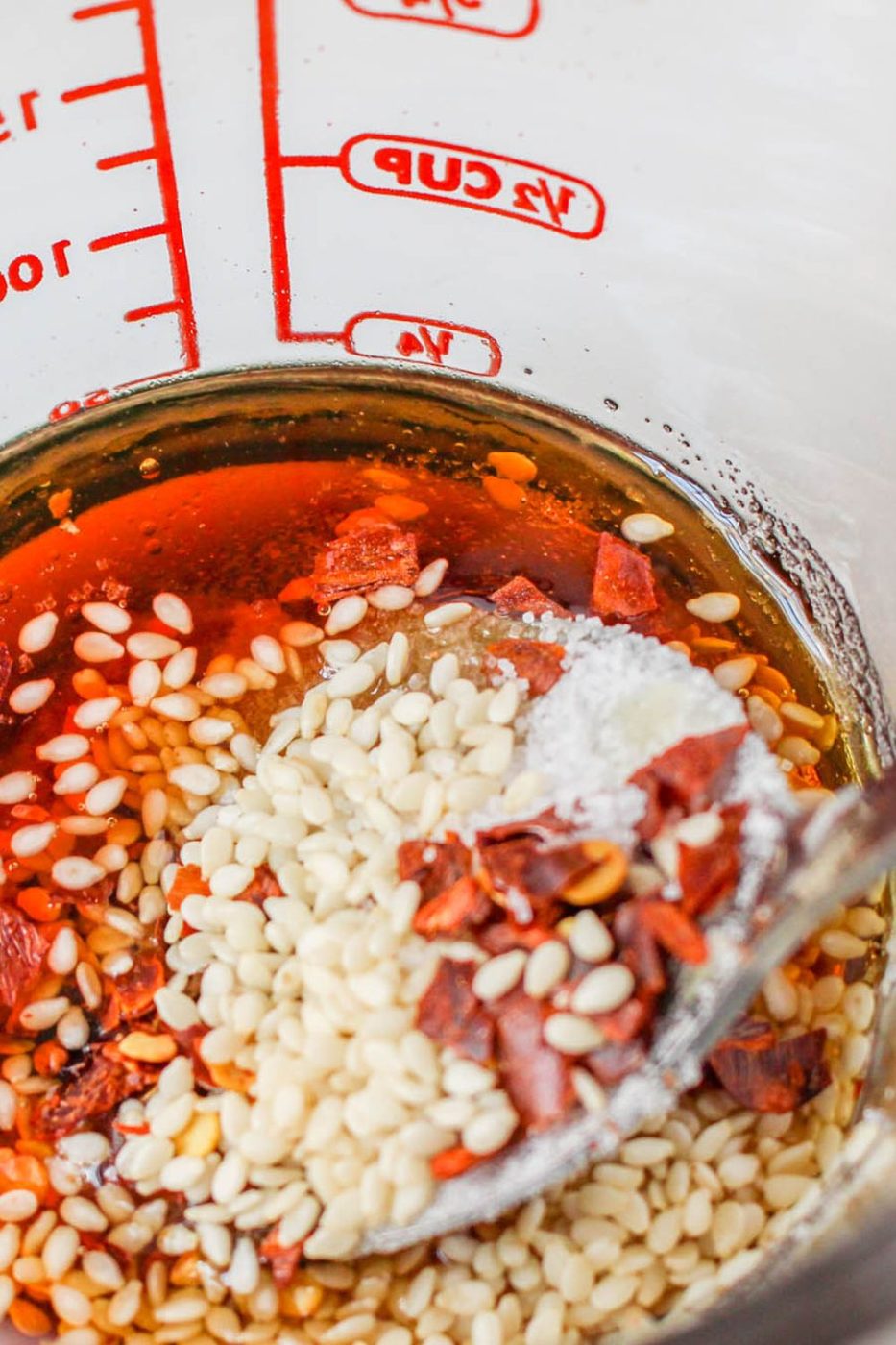 Oi Muchim sauce in a measuring cup