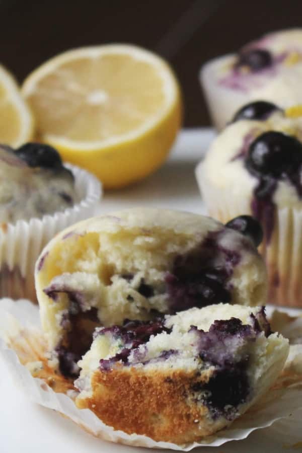 open lemon blueberry muffin on a plate