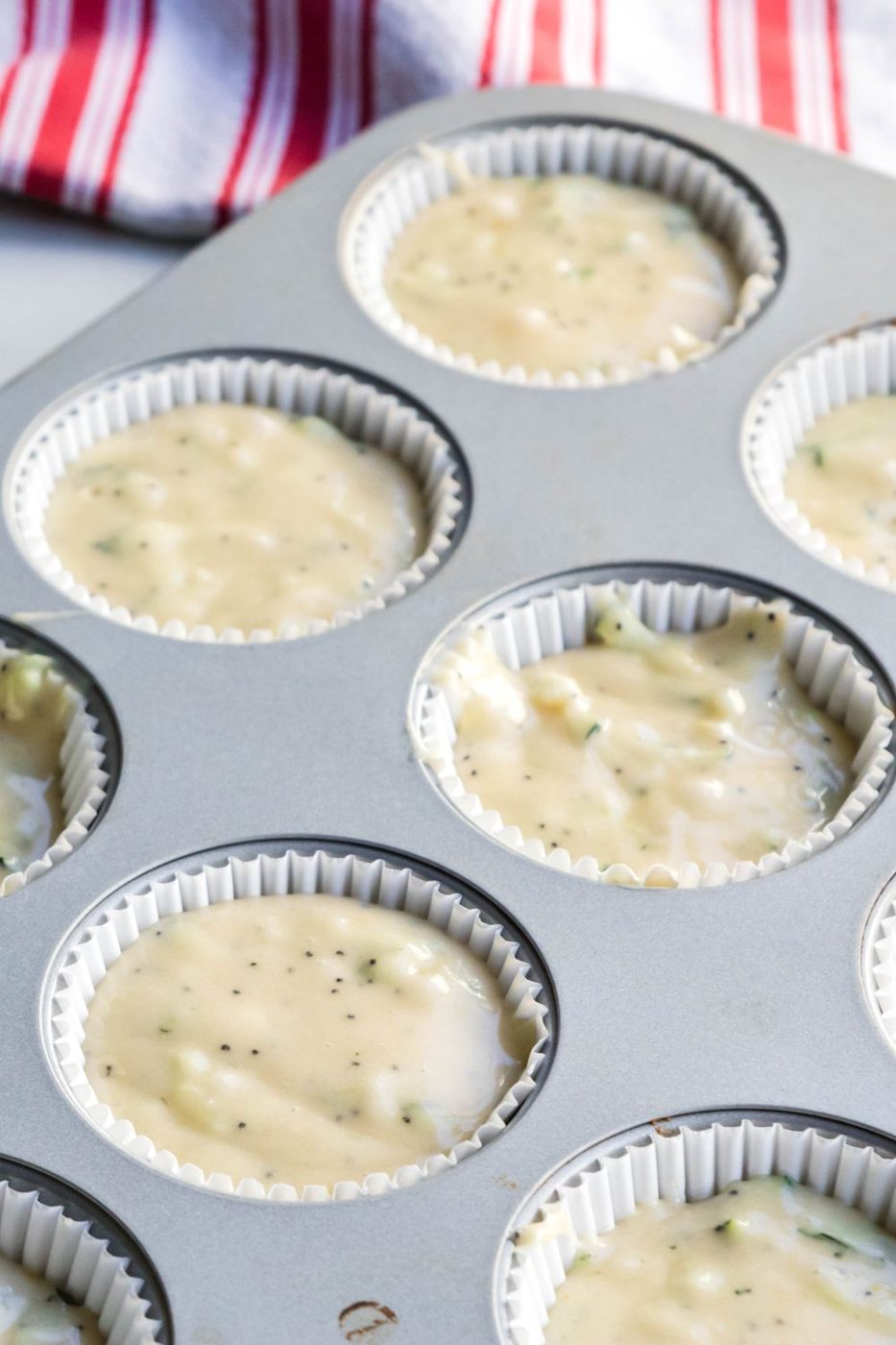 lemon zucchini muffin batter in pan
