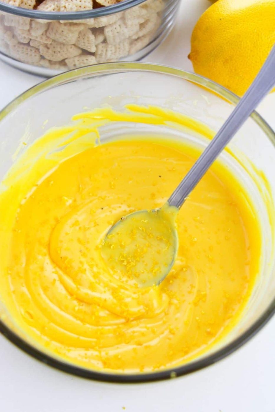 melted chocolate in a bowl with lemon zest in it 