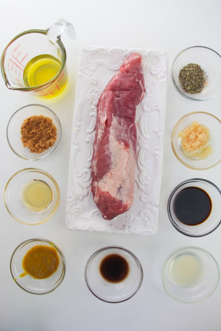 all the ingredients for making a Marinated Air Fryer Pork Tenderloin on a white table 