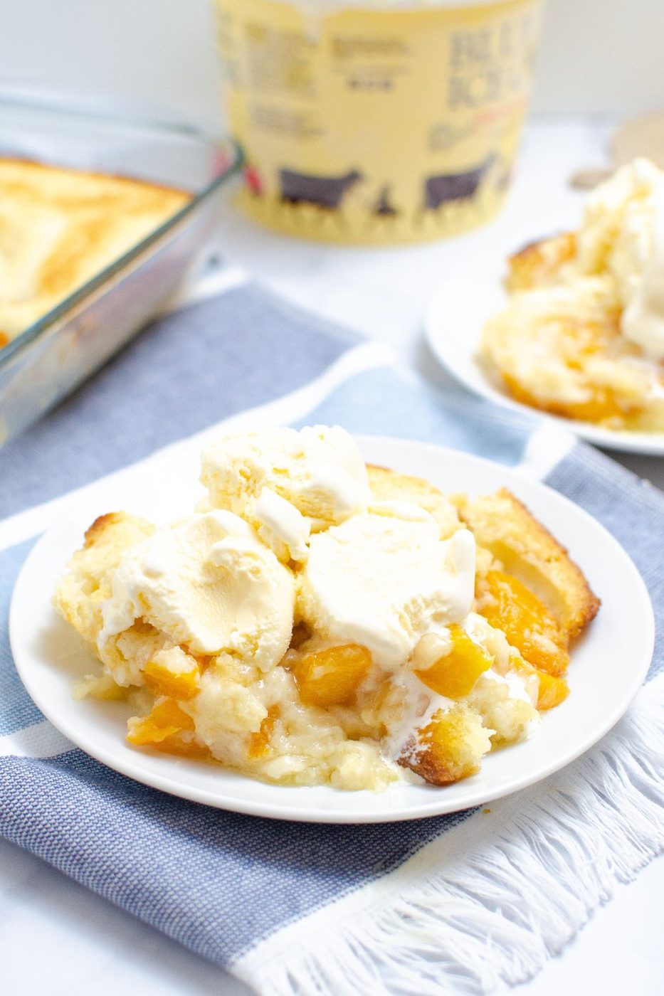 cobbler on plate with ice cream on top 