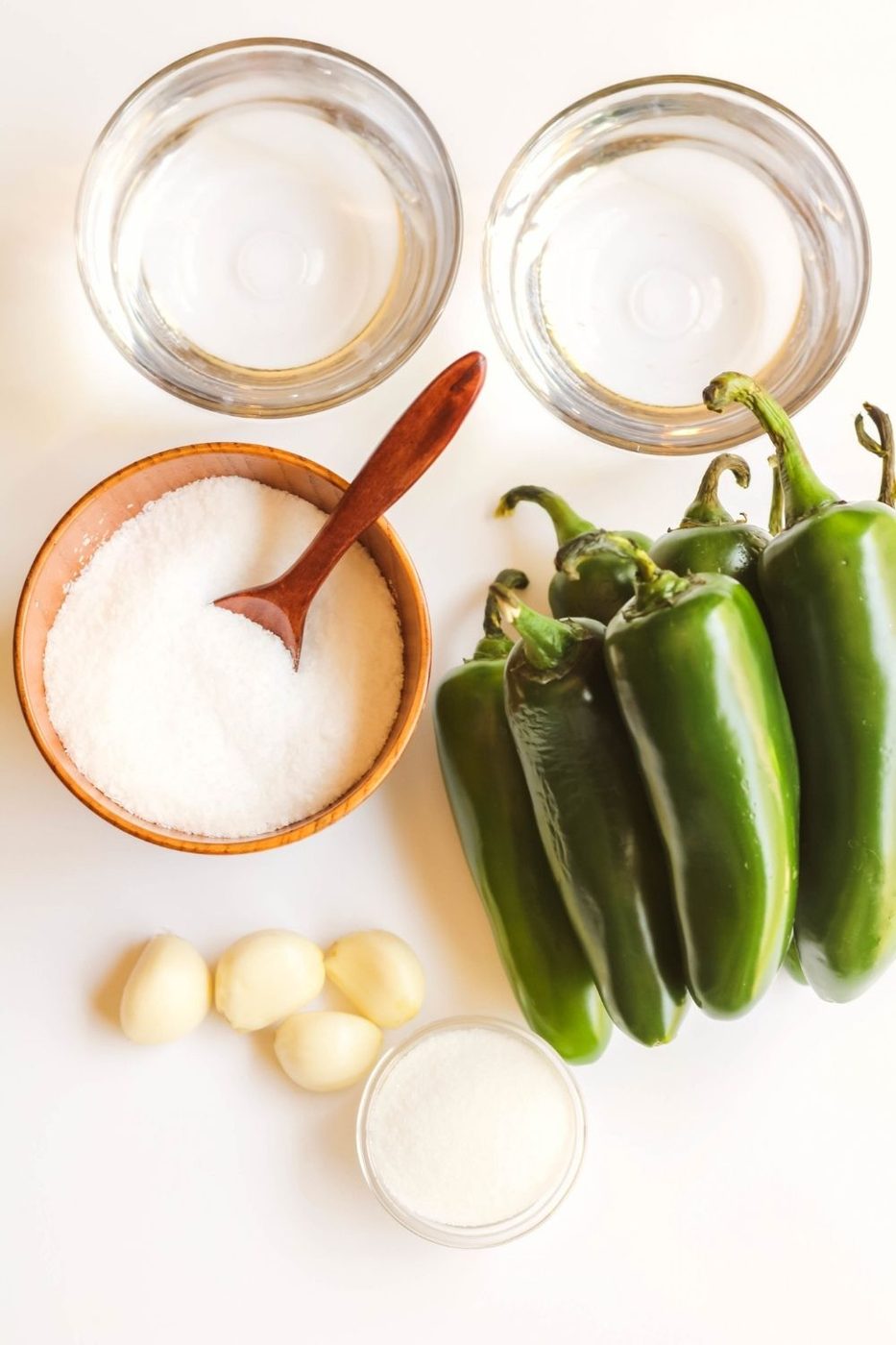 pickled jalapeno on white table 