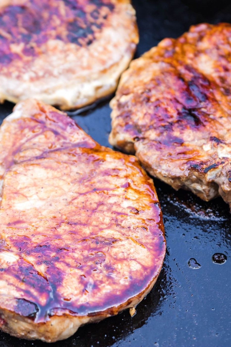 blackstone pork chops in process of cooking 