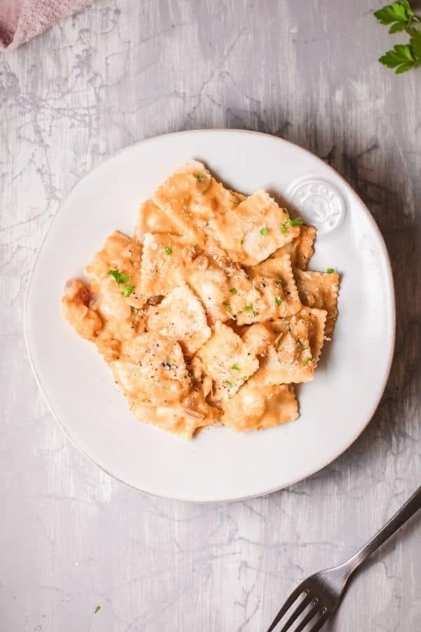 plate of pumpkin sauce and ravioli