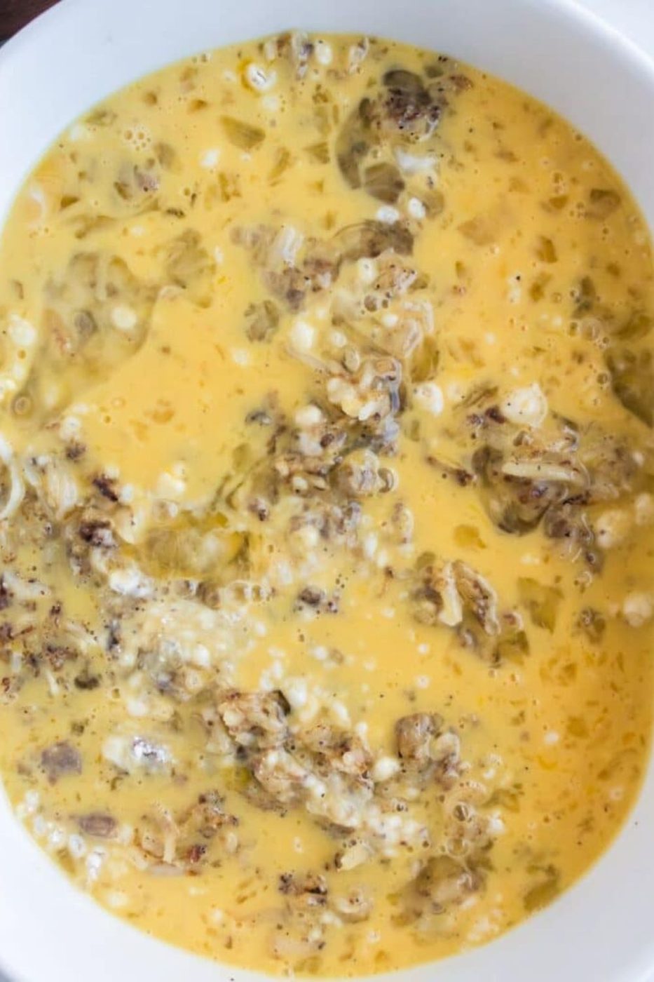 raw Sausage and Egg Casserole in a pan 