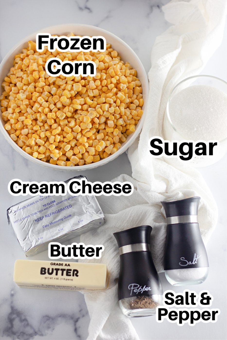 ingredients for corn in a skillet on a marble counter 