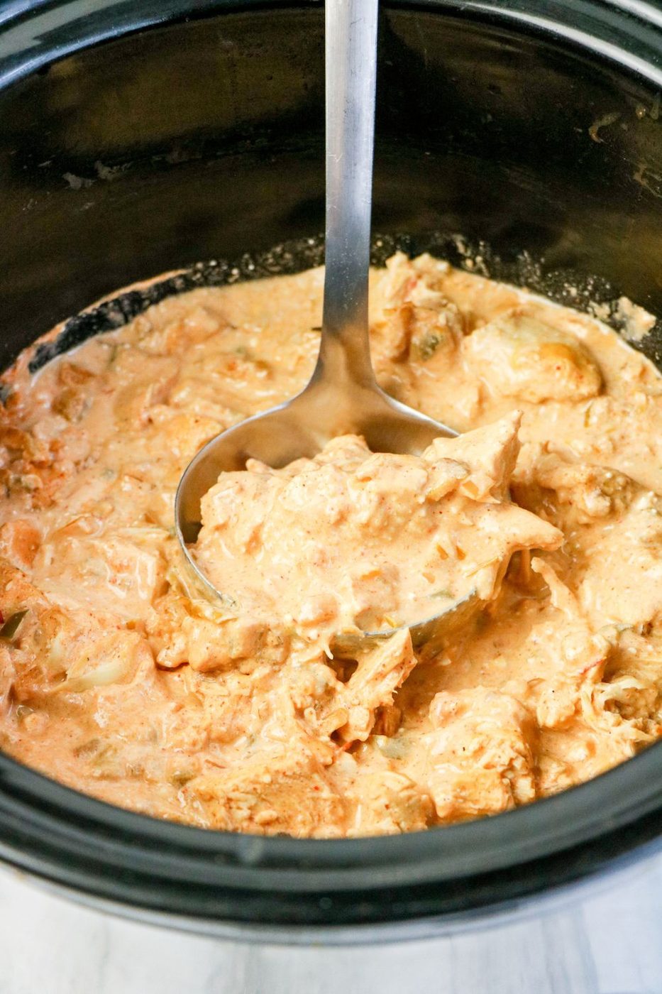 mexican chicken in crockpot with ladle in it 