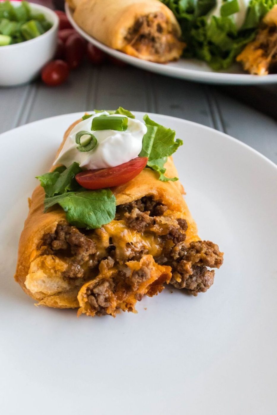 plate with a taco crescent roll recipe and more to the side 