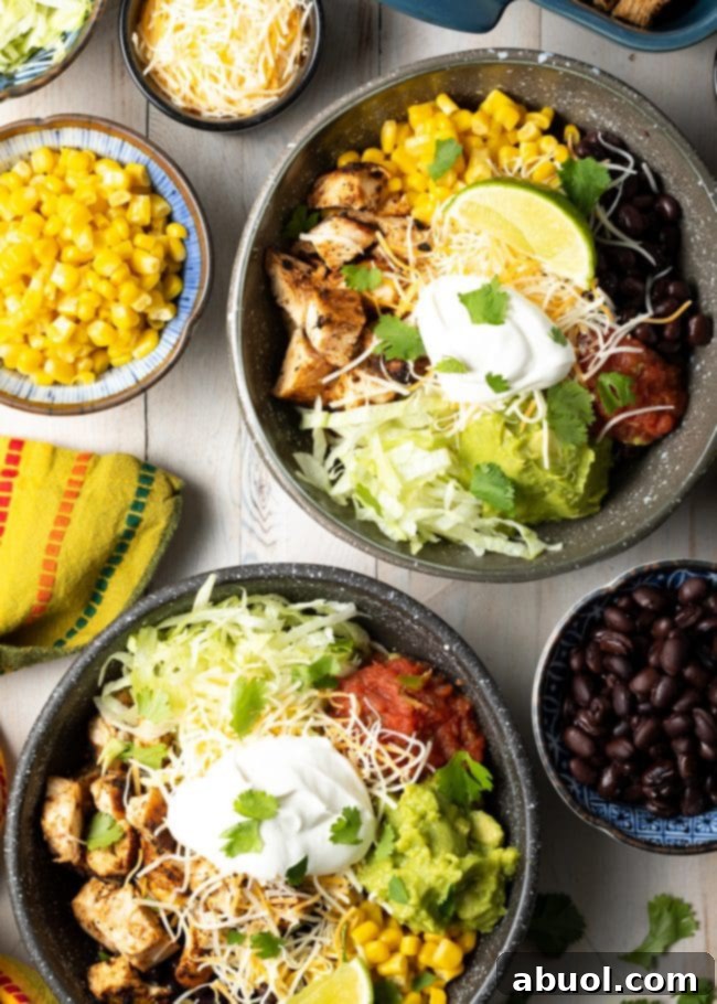 grilled chipotle chicken burrito bowls with beans, corn, southwestern toppings