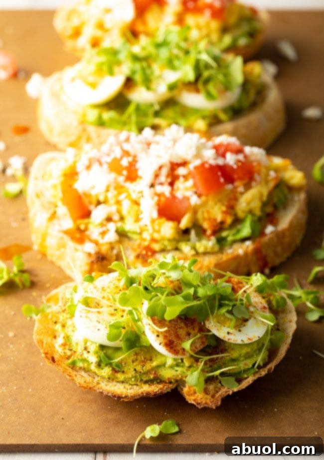 The Perfect Avocado Toast with Egg 4 Avocado toast with egg and microgreens on a white plate