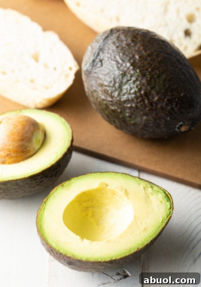 The Perfect Avocado Toast with Egg 5 Avocado being mashed on toast