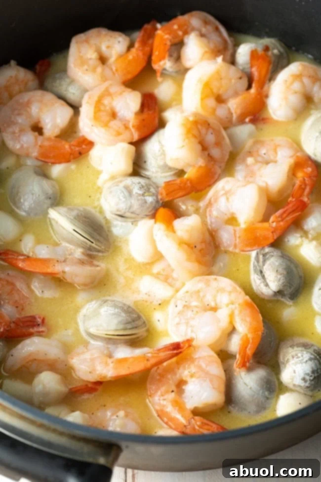 Fresh shrimp, scallops, clams in garlic and butter.