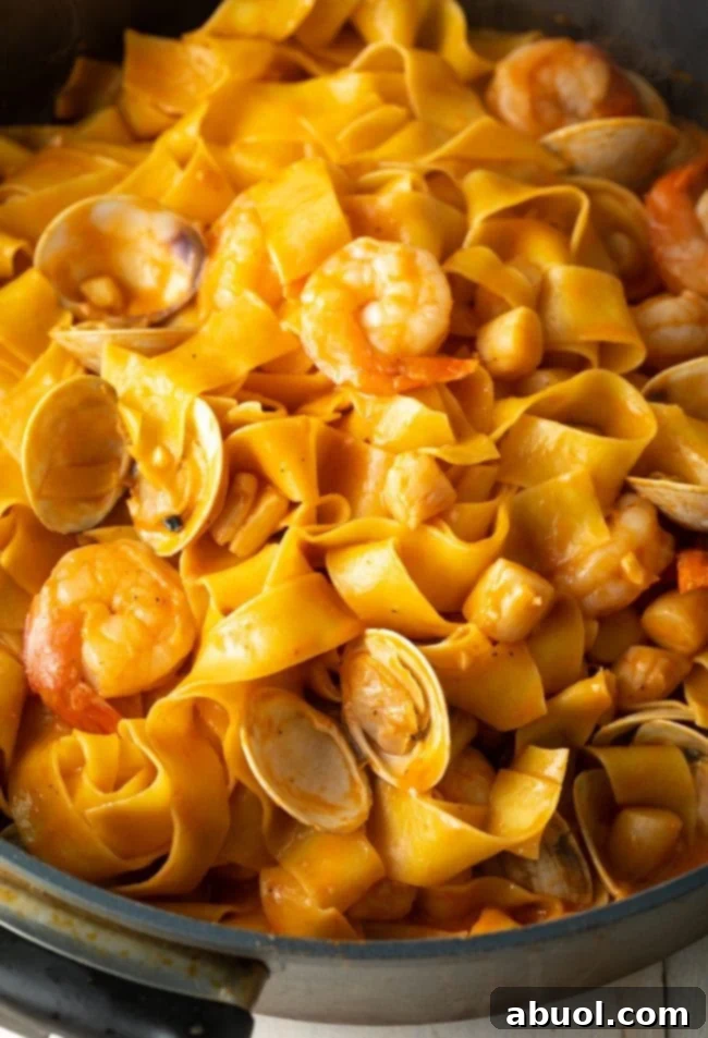 Pappardelle noodles with a rich seafood and tomato sauce.