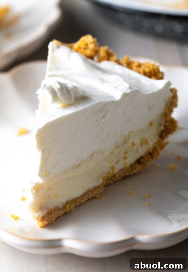 slice of icebox pie with creamy lemon filling and whipped topping
