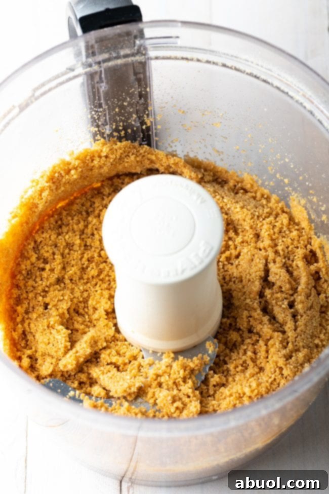 graham cracker crust being made in the food processor