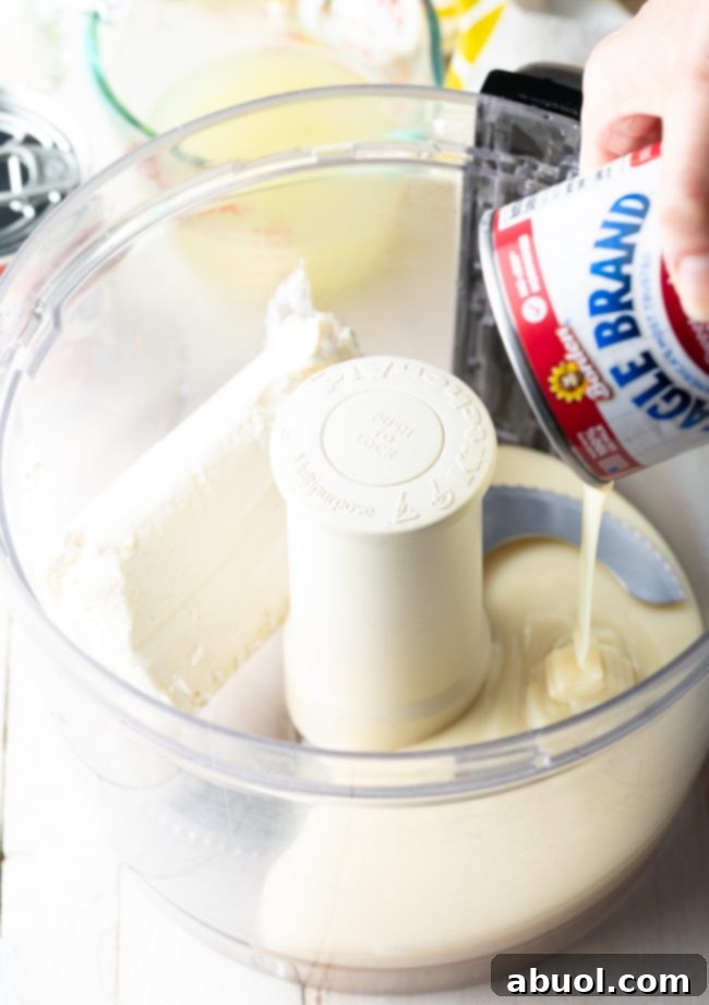 evaporated milk and cream cheese in a food processor