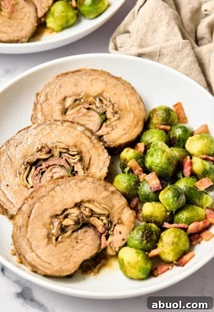 Stuffed Flank Steak Recipe with Prosciutto and Mushrooms beautifully plated and ready to serve.