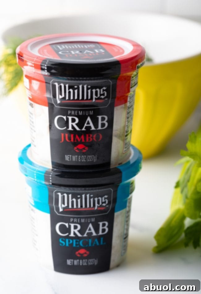 Two containers of crab meat stacked on top of each other.