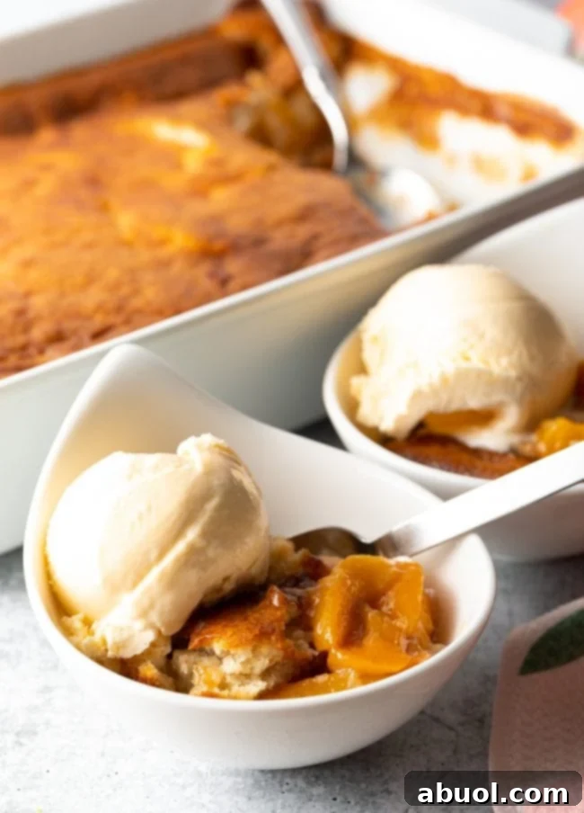 Easy homemade peach cobbler made with Bisquick, served warm in a baking dish