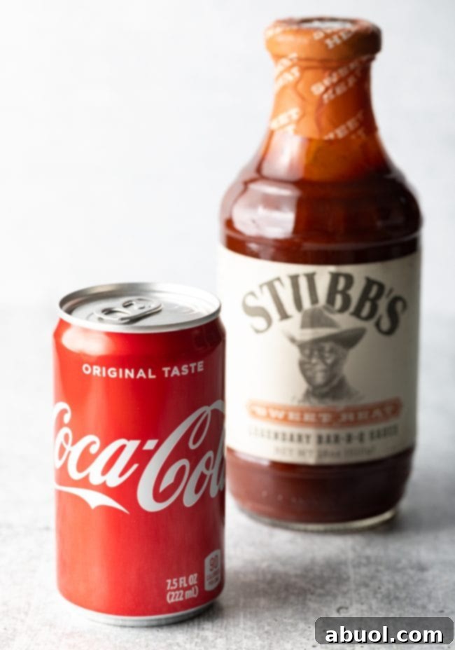 Oven-Baked Brisket Burnt Ends 4 Can of Coca-COla and bottle of Stubb's B-B-Q sauce.