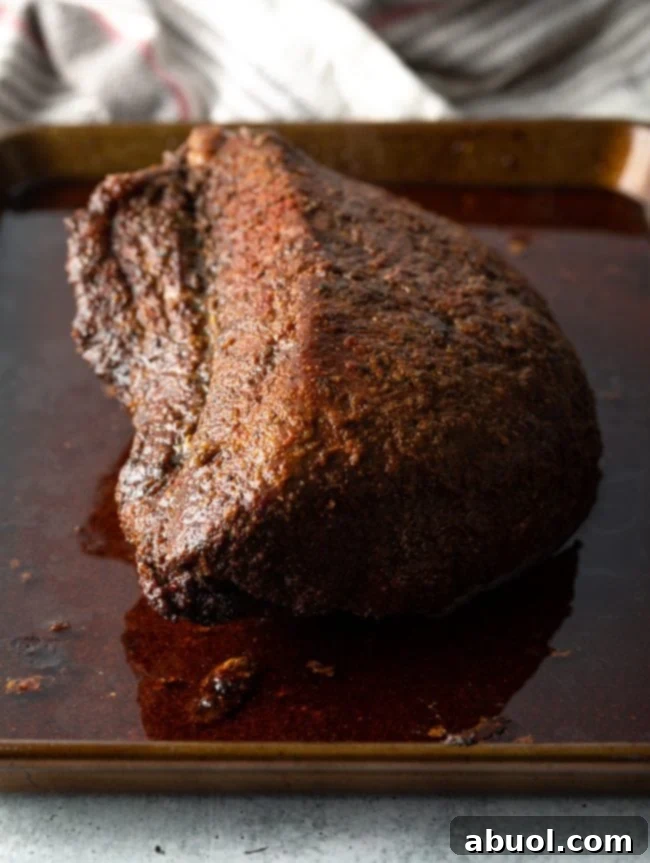 Oven-Baked Brisket Burnt Ends 6 Smoked beef on a baking sheet.