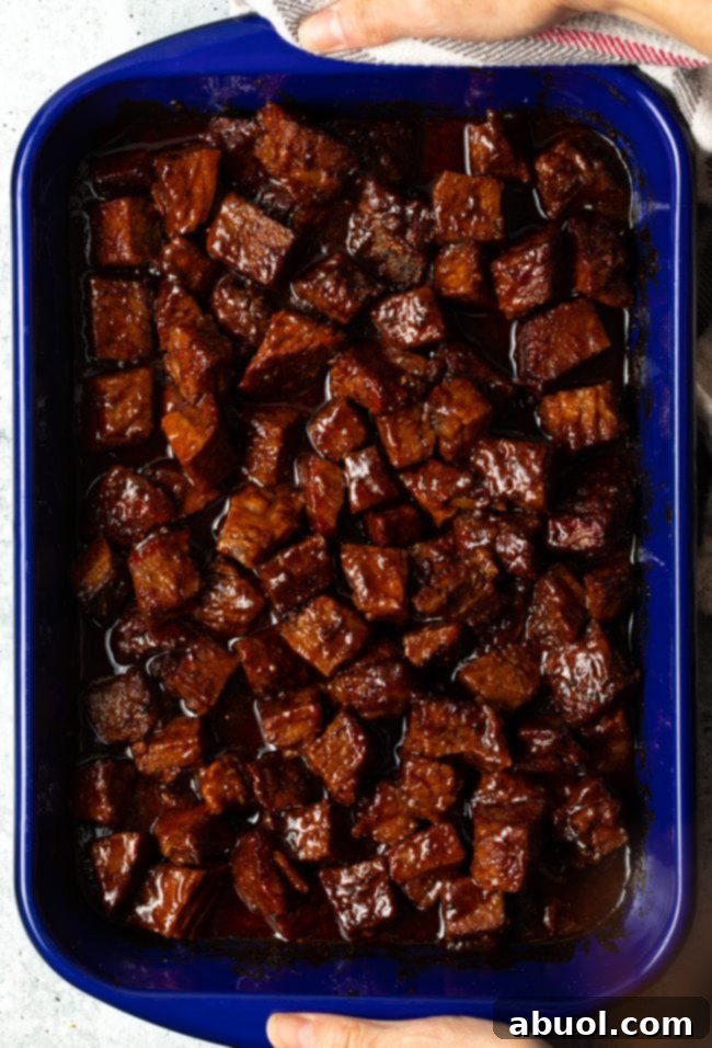 Oven-Baked Brisket Burnt Ends 9 Overhead view of brisket burn ends in bbq sauce.