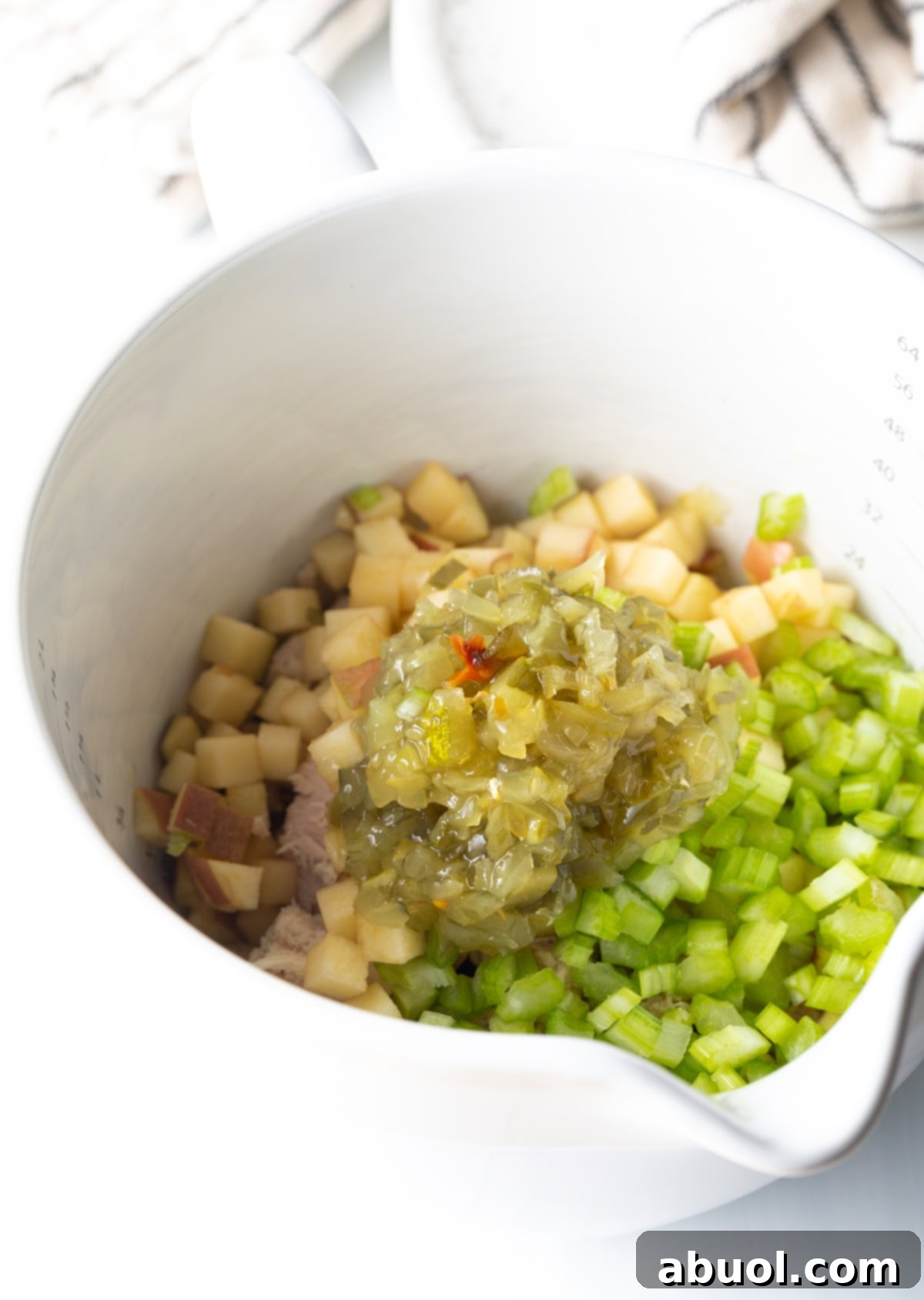 Crisp, diced apples, ready to add a sweet crunch to the tuna salad.