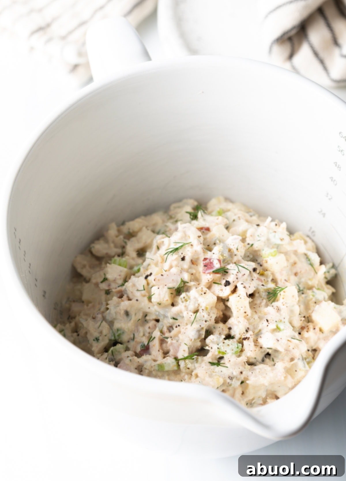Freshly chopped dill, imparting an aromatic and herbaceous flavor.